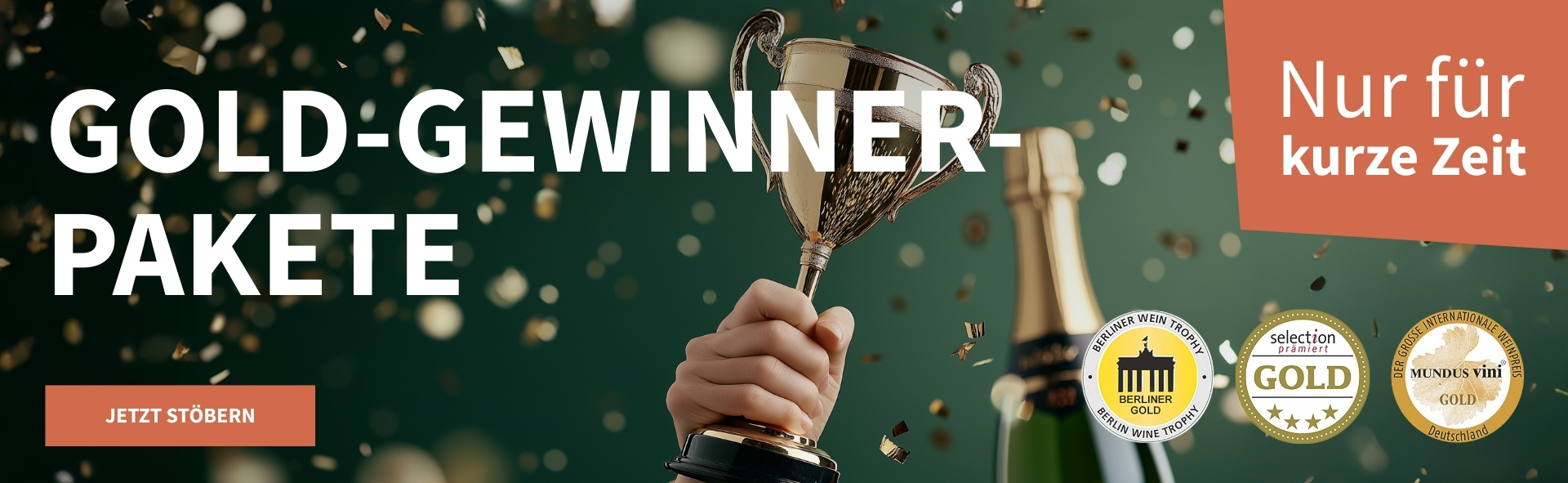 Meravino Weinaktion mit dem Slogan "Gold-Gewinner-Pakete". Dunkelgrüner Hintergrund mit goldenem Konfetti, davor eine Flasche Champagner und ein goldener Pokal. Hinweis auf "Nur für kurze Zeit". Unten Button "Jetzt stöbern". Rechts drei Plaketten.