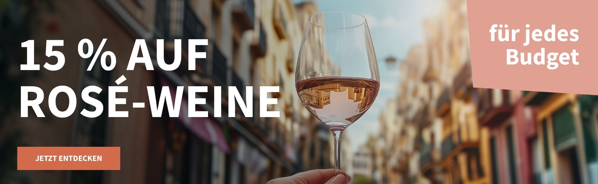 Meravino Weinaktion mit dem Slogan "15 % auf Rosé-Weine". Im Hintergrund eine Passage mit Hausfassaden, davor ein Glas Rosé, das in einer Hand gehalten wird. Hinweis auf "für jedes Budget". Unten Button "Jetzt entdecken".