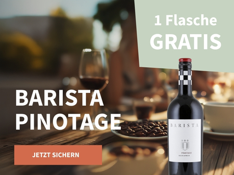 Meravino Weinaktion mit dem Slogan "Barista Pinotage". Im Hintergrund Kaffeebohnen, eine Tasse Kaffee und ein Glas Rotwein auf einem Tisch. Hinweis auf "1 Flasche gratis". Rechts eine Flasche Barista Pinotage.